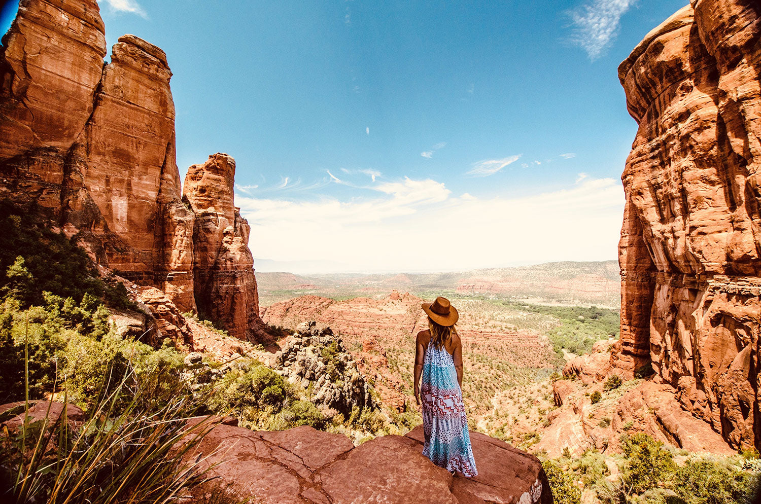 online life coach looks out over desert valley