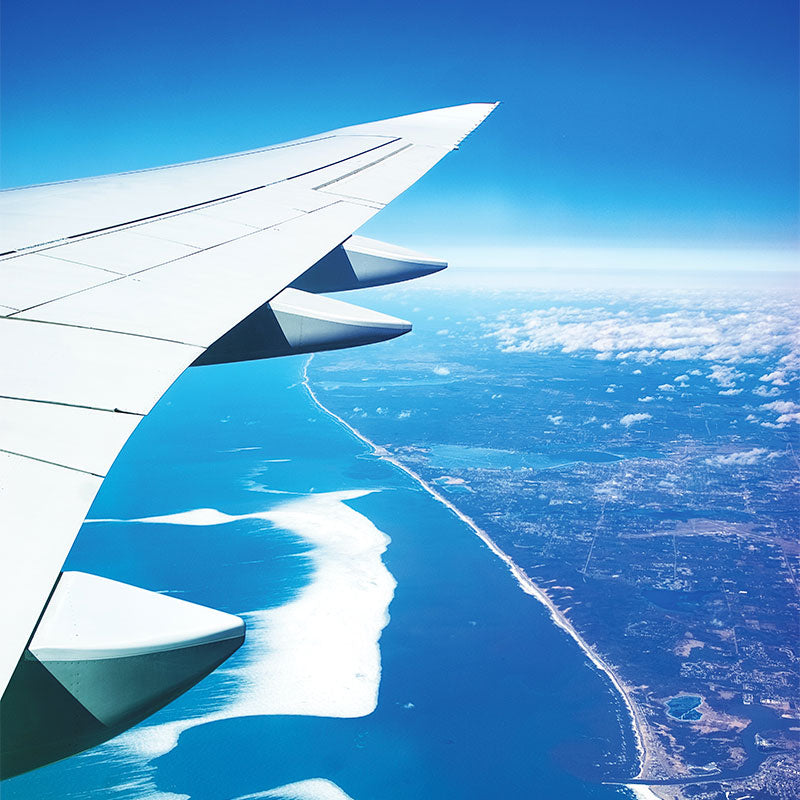 travel resources, airplane wing over aerial view