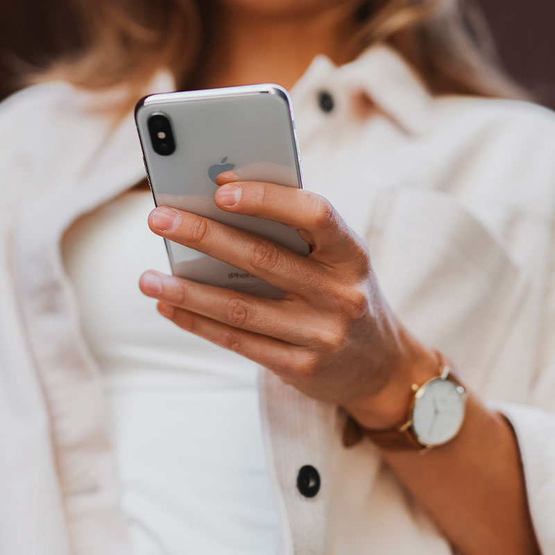 woman holding phone, hotlines