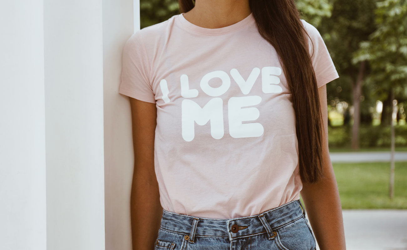 woman wearing I Love Me shirt, self partnered